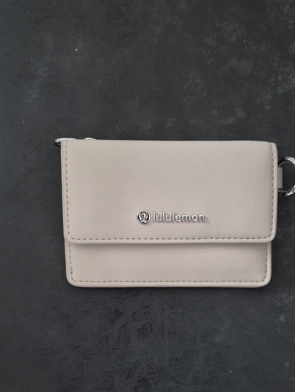 lululemon athletica beige compact wallet with silver logo